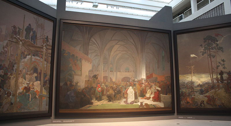 Alfons Mucha 1860 - 1939: 
Foto vom Triptychon „Die Magie der Worte” des 'Slavischen Epos'.
Veletržní Palac der Nationalgalerie Prag. 
Bildquelle: Krokodyl 2012 commons.wikimedia