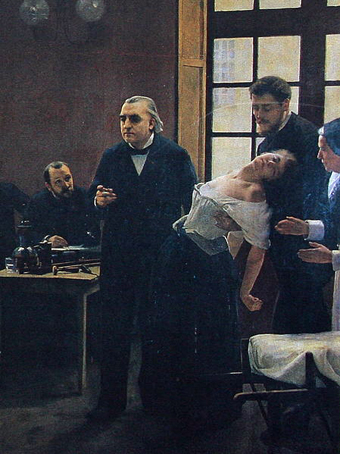 Jean-Martin Charcot, 1825 - 1893, onderwijst aan het Salpêtrière in Parijs 
en toont de gehypnotiseerde ‘Blanche’ Marie Wittman in hysterie. 
Student Joseph Babinski assisteert.
Door André Brouillet, 1887.
David Monniaux 2004 commons.wikimedia